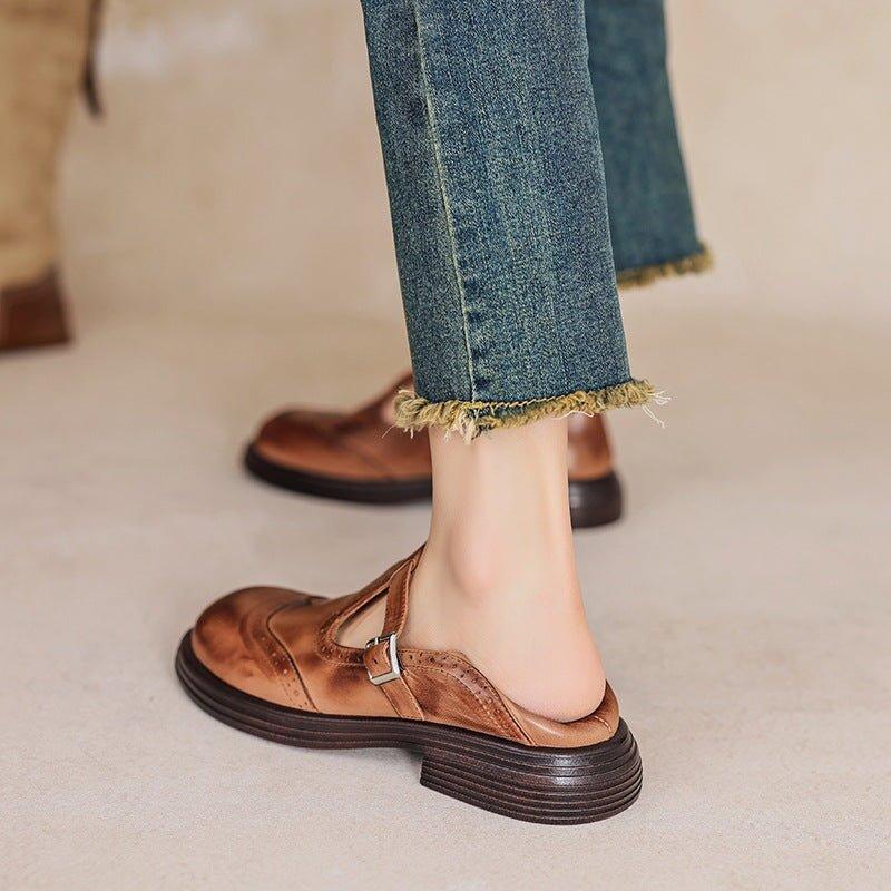 women's perforated Mary Jane buckle flats in Black - front view