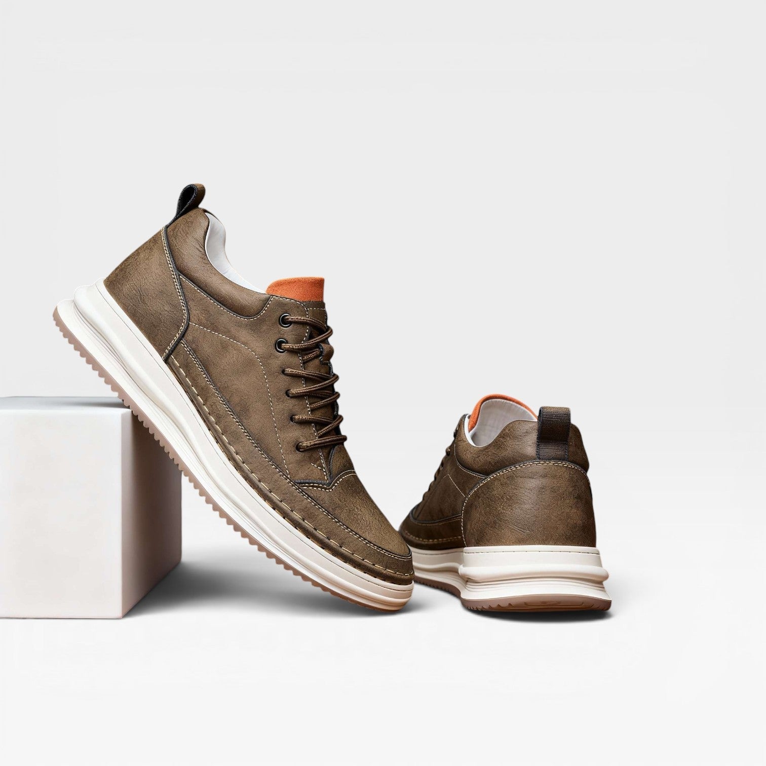 Close-up burnished leather trainers hand-stitched upper detail